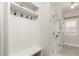 Bright mudroom featuring built-in bench, coat hooks, and storage for organization at 12467 Topaz Vista Way, Castle Pines, CO 80108