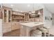 Custom wet bar with light wood cabinets and shelves, brick accents, and three bar stools at 12467 Topaz Vista Way, Castle Pines, CO 80108