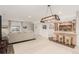 Finished basement including bar area with seating, lighting, and brick accents at 12467 Topaz Vista Way, Castle Pines, CO 80108