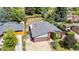 Aerial view of a charming home with a well-manicured lawn and a detached garage at 1430 Mount Evans Dr, Longmont, CO 80504
