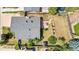 Birds-eye view of a home, highlighting the patio and lush surroundings with mature trees and landscaping, adding value to the home at 1430 Mount Evans Dr, Longmont, CO 80504