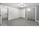 Basement room featuring painted concrete floors and double door closet at 1430 Mount Evans Dr, Longmont, CO 80504