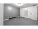 View of an unfinished basement room with painted concrete floor and closet at 1430 Mount Evans Dr, Longmont, CO 80504