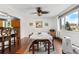 Bright dining area featuring a ceiling fan and a large window bringing in lots of natural light at 1430 Mount Evans Dr, Longmont, CO 80504