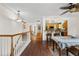 Inviting entryway showcasing hardwood floors that flow into the dining and kitchen area with bar seating at 1430 Mount Evans Dr, Longmont, CO 80504
