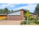 Charming single Gathering home with well-kept front lawn, attached garage and brick facade at 1430 Mount Evans Dr, Longmont, CO 80504