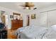 Bright main bedroom with a dresser, closet, and en-suite bathroom at 1430 Mount Evans Dr, Longmont, CO 80504