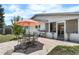 Inviting backyard patio with dining set and grill near the house, creating an ideal space for outdoor dining at 1430 Mount Evans Dr, Longmont, CO 80504