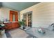 Enclosed patio with light blue ceiling and built in cherry wood cabinetry at 1430 Mount Evans Dr, Longmont, CO 80504
