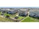 Aerial view of a backyard with a patio and lush green grass at 42395 Forest Oaks Dr, Elizabeth, CO 80107