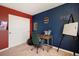 This room features a desk, a dry erase board, and playful decor at 42395 Forest Oaks Dr, Elizabeth, CO 80107