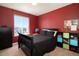 Bright bedroom with large window, modern furniture, and closet at 42395 Forest Oaks Dr, Elizabeth, CO 80107