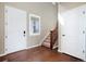 Welcoming foyer with hardwood floors, staircase, and natural light from the window at 42395 Forest Oaks Dr, Elizabeth, CO 80107