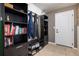 Functional mud room with built-in storage, shelving, and a convenient bench at 42395 Forest Oaks Dr, Elizabeth, CO 80107