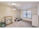 Bright, empty bedroom with two windows, neutral walls, and carpeted floor, ready for personalization at 7920 E Phillips Cir, Centennial, CO 80112
