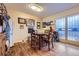 Cozy dining area with wood floors and door leading outside, ideal for casual meals at 7920 E Phillips Cir, Centennial, CO 80112