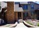 Charming brick townhouse with a well-maintained front yard and inviting entrance at 7920 E Phillips Cir, Centennial, CO 80112