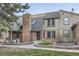 Charming home exterior featuring a brick facade, walkway, and well-maintained landscaping at 7920 E Phillips Cir, Centennial, CO 80112