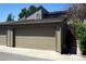 Attached garage with tan exterior at 7920 E Phillips Cir, Centennial, CO 80112