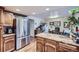 Bright kitchen with stainless steel appliances and wood cabinetry, perfect for cooking at 7920 E Phillips Cir, Centennial, CO 80112