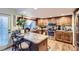 Well-equipped kitchen with ample counter space, stainless steel appliances, and natural lighting at 7920 E Phillips Cir, Centennial, CO 80112