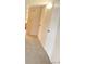 Carpeted hallway with white doors and trim at 9108 E Lehigh Ave, Denver, CO 80237