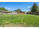 Expansive backyard with mature trees, storage sheds, and a partial privacy fence at 717 E 4Th Ave, Longmont, CO 80504