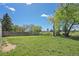 Expansive backyard featuring lush lawn and a wooden fence, providing ample space for outdoor activities and privacy at 717 E 4Th Ave, Longmont, CO 80504