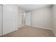 Neutral bedroom with carpet, closet, and natural light from an open doorway at 717 E 4Th Ave, Longmont, CO 80504
