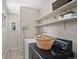 Bright laundry area with washer, dryer, utility sink and access to outdoor space at 717 E 4Th Ave, Longmont, CO 80504