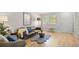 Inviting living room with hardwood floors, stylish furniture, and ample natural light at 717 E 4Th Ave, Longmont, CO 80504