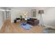 Open-concept living room with hardwood floors, stylish decor, and lots of natural light at 717 E 4Th Ave, Longmont, CO 80504
