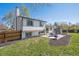 Spacious backyard featuring a patio with outdoor seating and a well-maintained lawn at 8004 S Field St, Littleton, CO 80128
