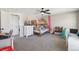 Spacious bedroom with bunk beds, a white dresser, and neutral walls and carpet at 8004 S Field St, Littleton, CO 80128