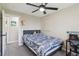 Neutral bedroom with a gray carpet, a gray upholstered headboard and white trim at 8004 S Field St, Littleton, CO 80128