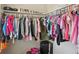 Organized walk-in closet with clothing, shoes, and accessories on multiple shelves at 8004 S Field St, Littleton, CO 80128