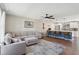 Open-concept living room with hardwood floors, neutral colors, and abundant natural light at 8004 S Field St, Littleton, CO 80128