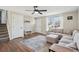 Open-concept living room with stairs, hardwood floors, and neutral colors, offering ample space at 8004 S Field St, Littleton, CO 80128