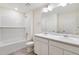 Elegant bathroom features a shower/tub combination and double vanity at 17949 Dandy Brush Ln, Parker, CO 80134