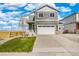 Charming two-story home featuring a two-car garage and neutral siding at 17949 Dandy Brush Ln, Parker, CO 80134