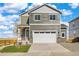 Charming two-story home featuring a two-car garage and neutral siding at 17949 Dandy Brush Ln, Parker, CO 80134