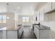 New kitchen offers stainless steel appliances, granite countertops, and an island; the space is bright and functional at 17949 Dandy Brush Ln, Parker, CO 80134