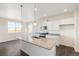 Well-lit kitchen offers a large island with granite counters, stainless appliances, and a view from the large window at 17949 Dandy Brush Ln, Parker, CO 80134