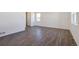 Spacious living area with wood-look floors and abundant natural light at 17949 Dandy Brush Ln, Parker, CO 80134