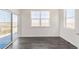 Open living room features large windows and sliding door, allowing for plenty of natural light and scenic views at 17949 Dandy Brush Ln, Parker, CO 80134