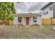 Charming single-story home with a vibrant red front door and decorative flower boxes at 1680 Simms St, Lakewood, CO 80215