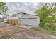 View of the detached two-car garage in the backyard at 1680 Simms St, Lakewood, CO 80215