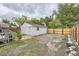 View of the detached garage and fence in the backyard at 1680 Simms St, Lakewood, CO 80215