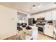 Open-concept kitchen with stainless steel appliances and view to living area at 1680 Simms St, Lakewood, CO 80215