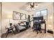 Inviting living room with ample natural light, a modern sofa, unique decor, and a dedicated workspace perfect for work from home at 1680 Simms St, Lakewood, CO 80215